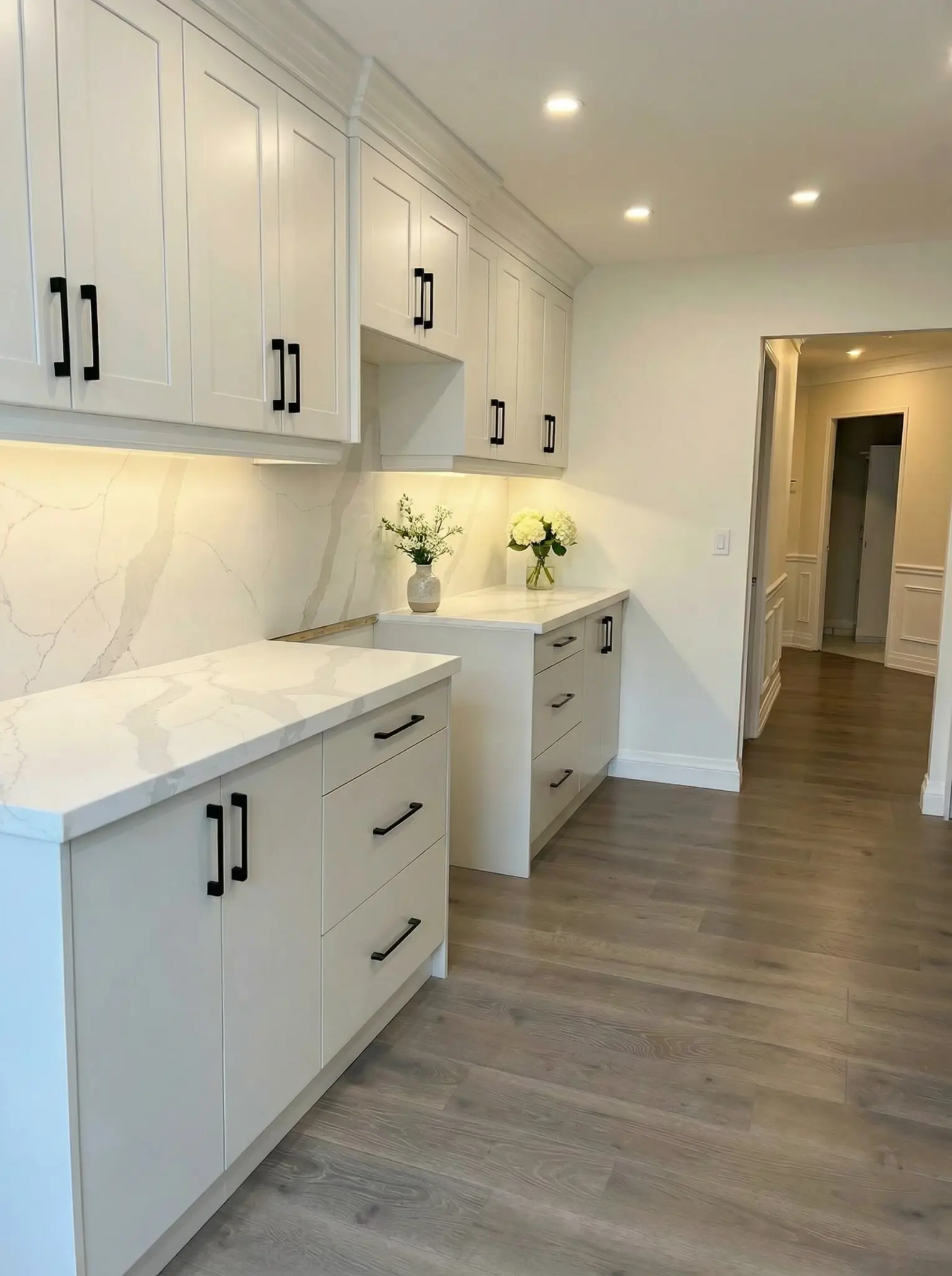 White Shaker kitchen with quartz counters